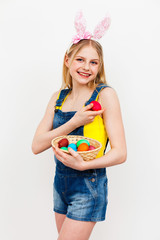 Teenage girl holding Easter eggs