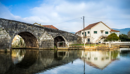 Fototapeta na wymiar Picturesque portuguese village with a roman bridge