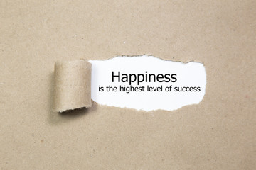 Happiness Is The Highest Level Of Success appearing behind torn paper. - obrazy, fototapety, plakaty