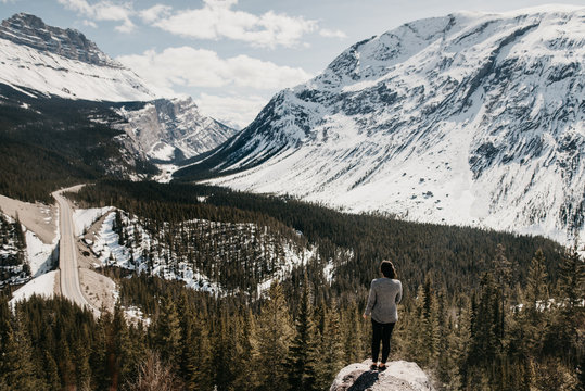Woman on rock with view