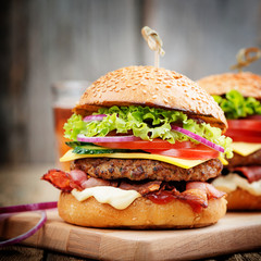 Delicious fresh homemade burger on a wooden table