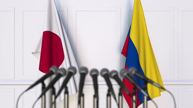 Flags of Japan and Colombia at international meeting or negotiations press conference
