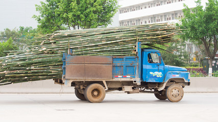 Overloaded truck in China with bamboo
