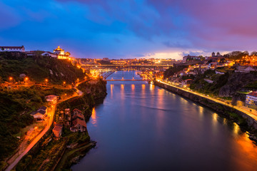 High Angle view on the Douro River and Dom Luis I Bridge in Porto Portugal at Dusk