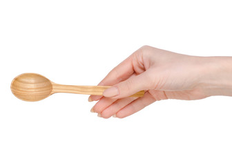 Wooden spoon in hands