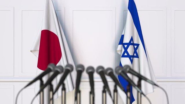 Flags of Japan and Israel at international meeting or negotiations press conference