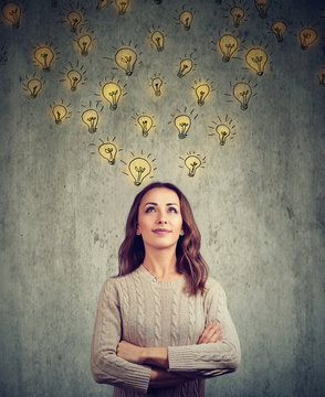 woman contemplating and looking up has many bright ideas