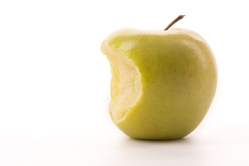 Bitten yellow apple on a white background.