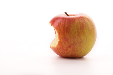 Bitten red apple on a white background.