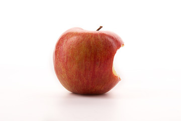 Bitten red apple on a white background.