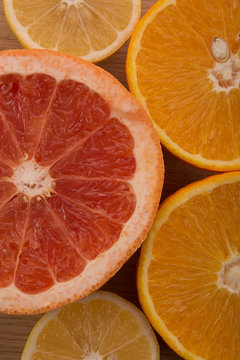 Slices of grapefruit, orange and lemon. Background.