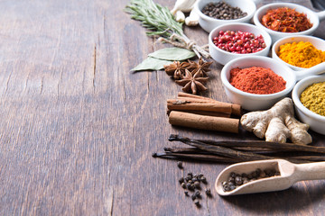 Herbs and spices in ceramic bowls.