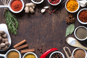 Herbs and spices in ceramic bowls.
