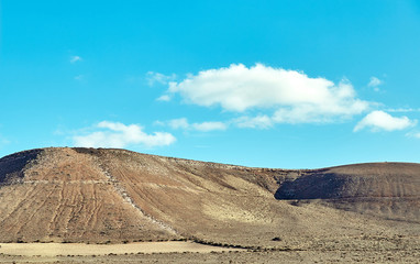 Volcanic hills and blue sky