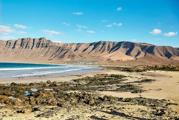 Foto auf Leinwand Landscape with volcanic hills and atlantic ocean in Lanzarote © Mara Zemgaliete
