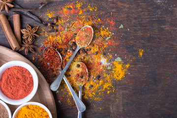Colorful spices in spoons
