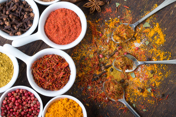 Colorful spices in spoons