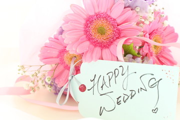 hand written happy wedding greeting card and flower bouquet