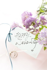 purple flower and wedding message on white background 