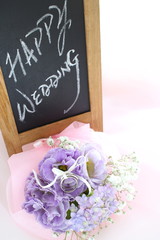 purple flower and wedding message on white background 