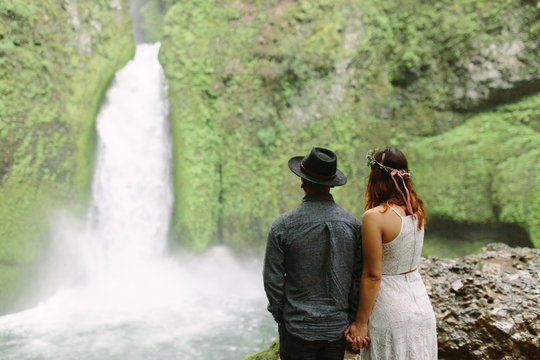 Couple Looking at Waterfall