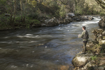 sport fisherman in river, Galicia, Spain.