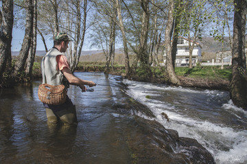 sport fisherman in river, Galicia, Spain.