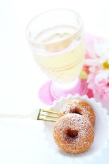 Homemade sugar donut on white dish