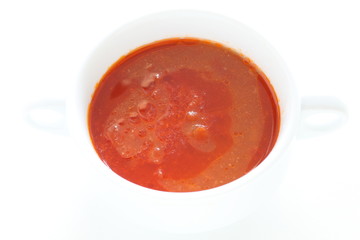 Tomato soup in white bowl