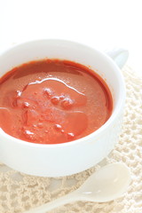 Tomato soup in white bowl