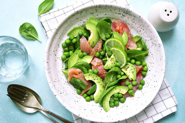 Green vegetable salad with salted salmon.Top view.