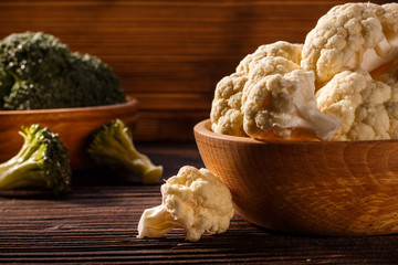 cauliflower and broccoli on a rustic background