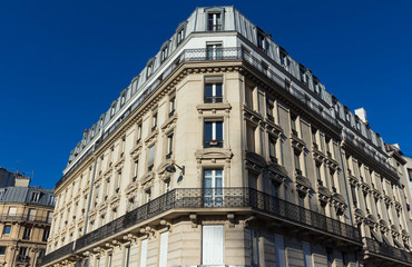 The traditional facade of Parisian building, France.