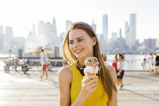 Young Beautiful Woman Eating an Icecrem in Brooklyn New York Cit