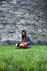 Beautiful young woman reading a book. (relax, romance, poetry, rest)