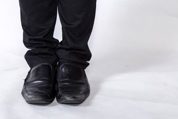 shoes and legs of a businessman caution step