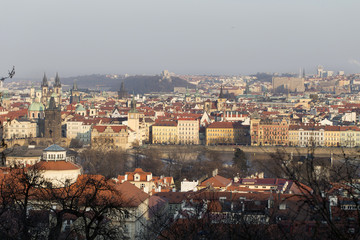 Obraz premium Sunny freezy winter Prague City with its Cathedrals, historical Buildings and Towers, Czech Republic