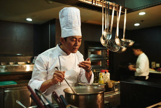 Proficient Asian cook at work