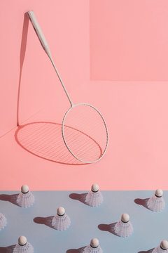 badminton rackets on pink and blue background