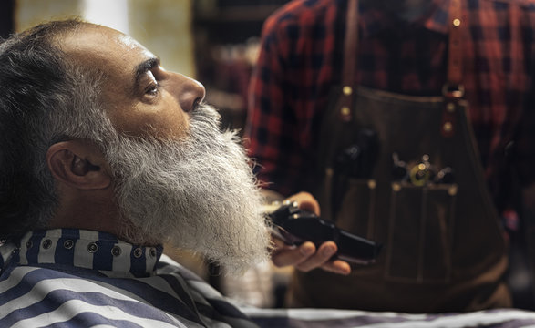 Man Having Beard Cut at Barber Shop