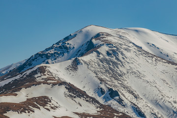 Fototapeta na wymiar Mountains landscape. Caucasian mountain ridge with snow caps, Arkhyz, Russia
