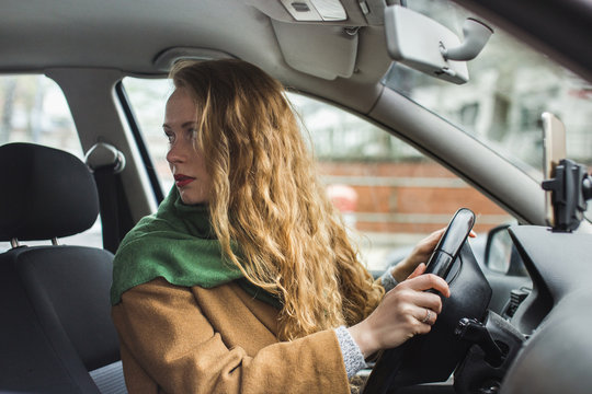 Red Headed Woman In A Car