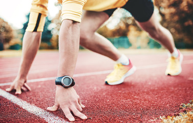 Fototapeta premium Runner on the start line, closeup photo. Sport, fitness, athletics concept
