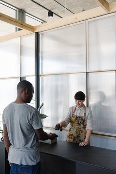 Woman scanning QR code on mobile phone