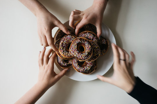 Teens eat doughnuts
