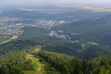 Fototapeta na wymiar Beautiful summer view from Mount Tserkovka to resort of Belokurikha in the Altai Krai
