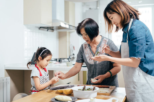 Family cooking in kitchen