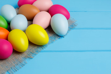easter eggs on blue wooden background
