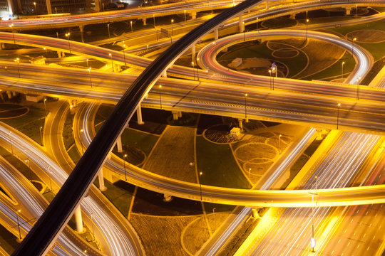 aerial view of busy traffic on sheikh zayed road intersection at night, Dubai - futuristic city