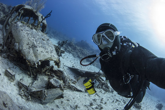 A scuba diver Selfie with airplane wreck